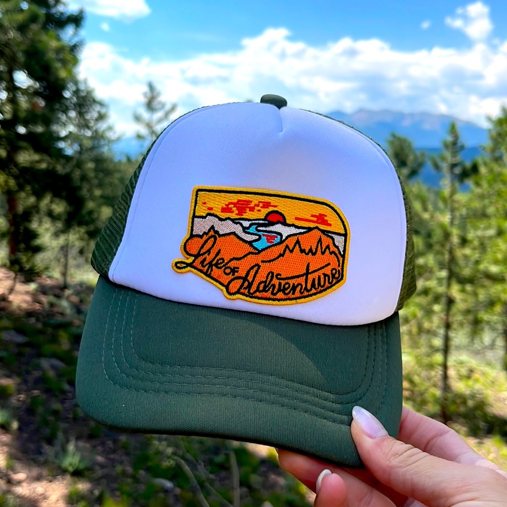 Baseball hat with sewn on “Life of Adventure” patch